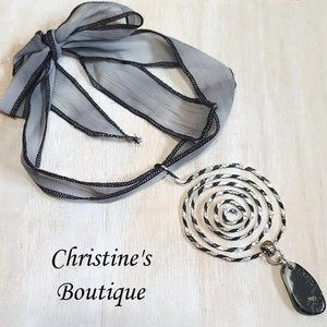 Handcrafted Pendant Necklace, hammered aluminum Silver and Black wire, on fabric